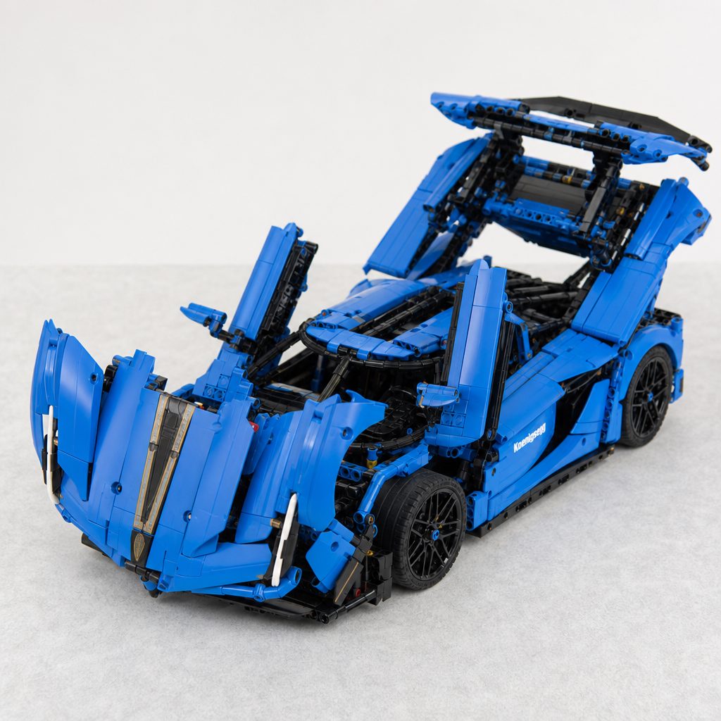 Ghost Mode links the rear clam, doors, mirrors and front hood in one theatrical opening sequence, but the individual panels are manually closed afterwards.