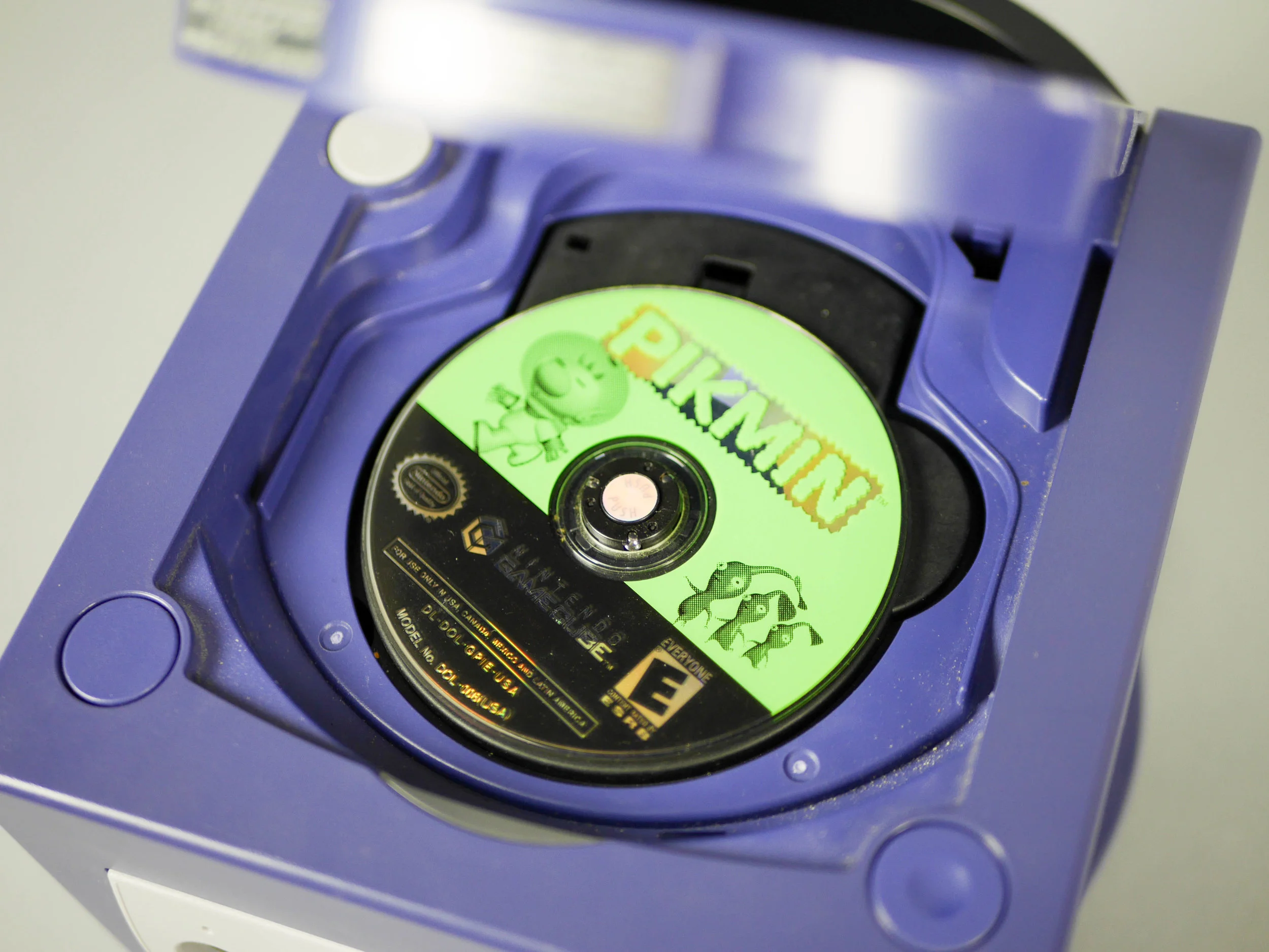 Design Detail image of Side or angled view of the Nintendo GameCube showing the disc lid and overall hardware design