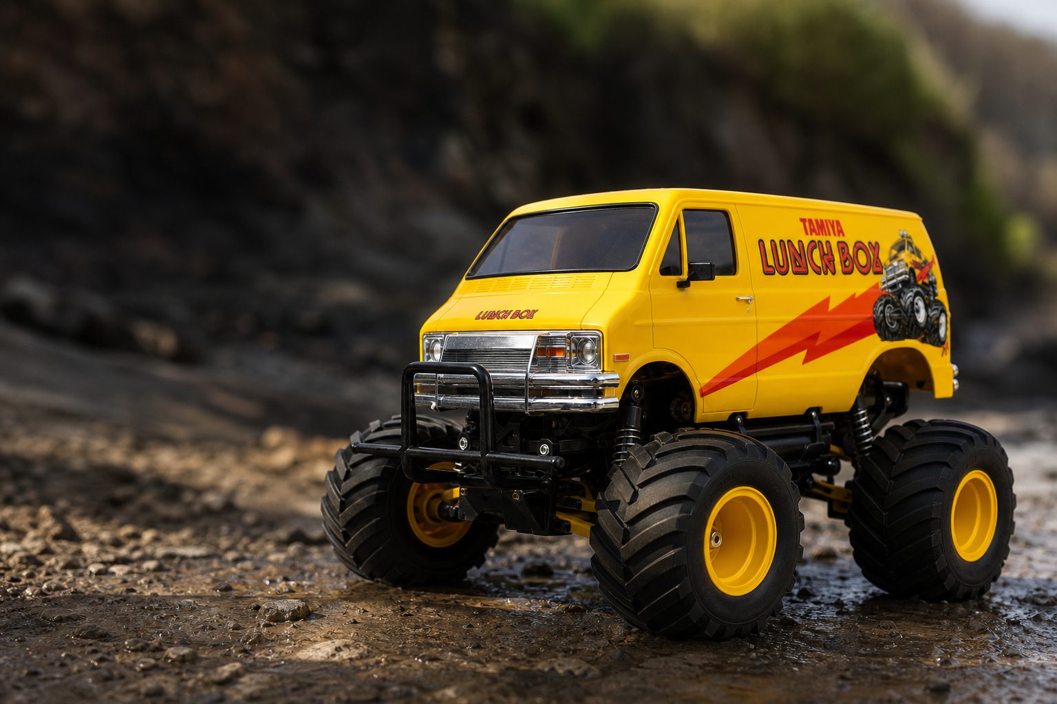 The classic yellow Tamiya Lunch Box remains one of RC's most recognisable silhouettes: huge tyres, a delivery-van body and absolutely no interest in appearing sensible.