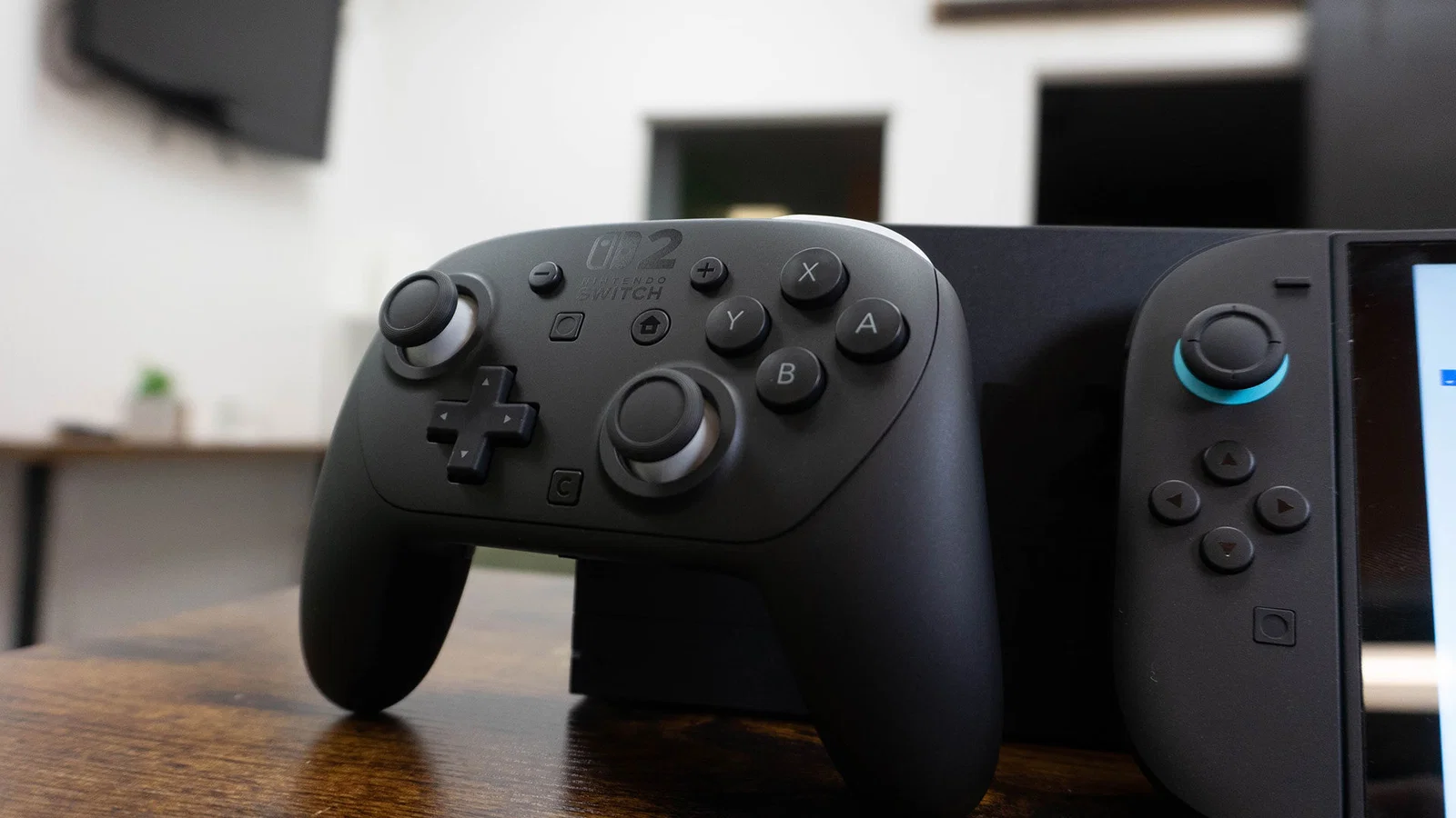 Latency and Performance Section image of Photo of a person's hands actively using the Nintendo Switch 2 Pro Controller while playing, showing natural grip and button placement